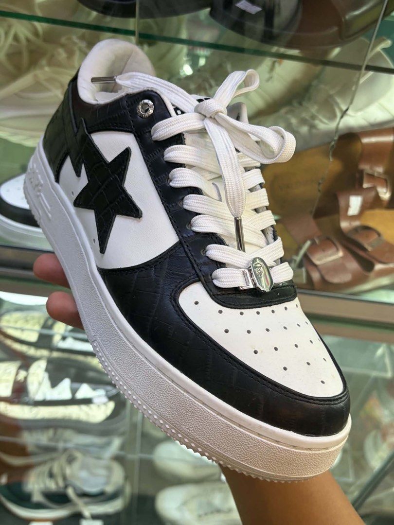 BAPE STA Low Black White Crocodile (Category: Sneakers) located in Manila. Submitted by manyi04 (Listing ID 1463366918, Image 1). Description: - Classic BAPE STA Low sneakers - Black and white colorway - Crocodile-embossed leather accents - Perforated toe box - Signature star logo on the side - White laces and chunky sole - Comes with a metal lace lock - Essential for any streetwear collection -Comes with box, pouch, and lace.