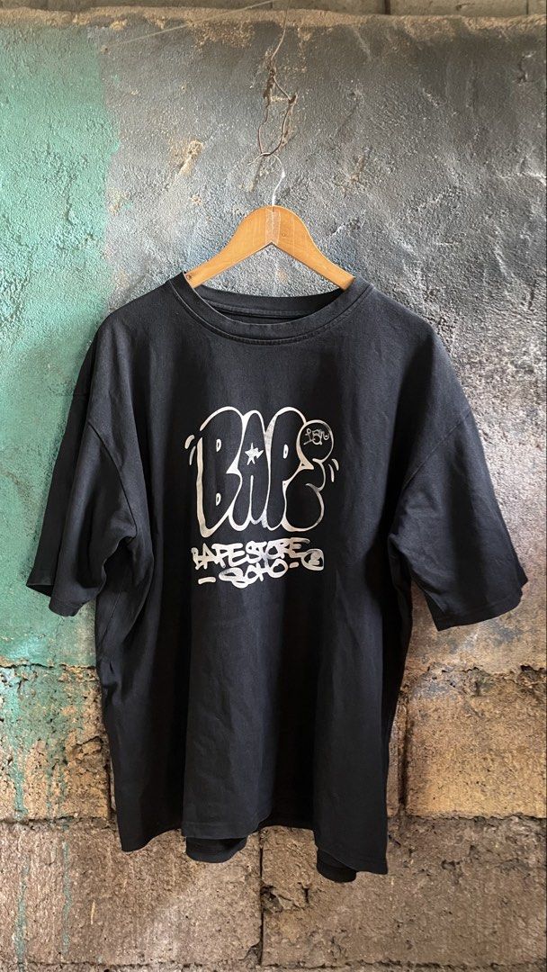 BAPE STORE SOHO Graphic Tee (Category: Tshirts & Polo Shirts ) located in Manila. Submitted by fivethreefinds (Listing ID 1463458948, Image 1). Description: - Authentic BAPE t-shirt - Color: Black - Front graphic print: 'BAPE STORE SOHO' - Style: Short sleeves, crew neck - Ideal for casual wear.