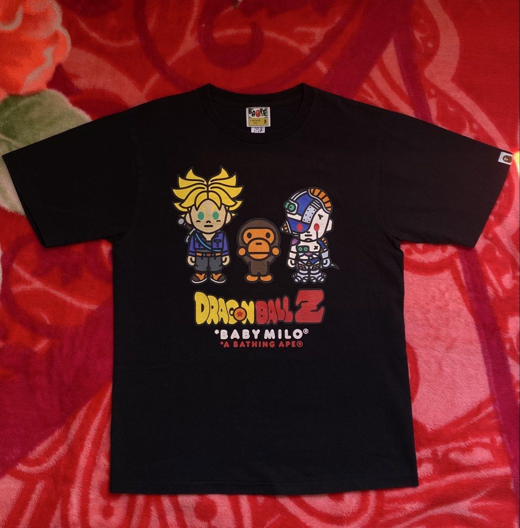 Bape x DBZ (Trunks & Mecha Frieza) (Category: Tshirts & Polo Shirts ) located in Quezon. Submitted by bapestaa (Listing ID 1463467886, Image 1). Description: (Details) • Bape x DBZ (Trunks & Mecha Frieza) • Size: Medium on tag • Dimes: 20.5x26.5 • Color Rate: 9.3 or better • Issue/s: None Quezon Province, 4301..