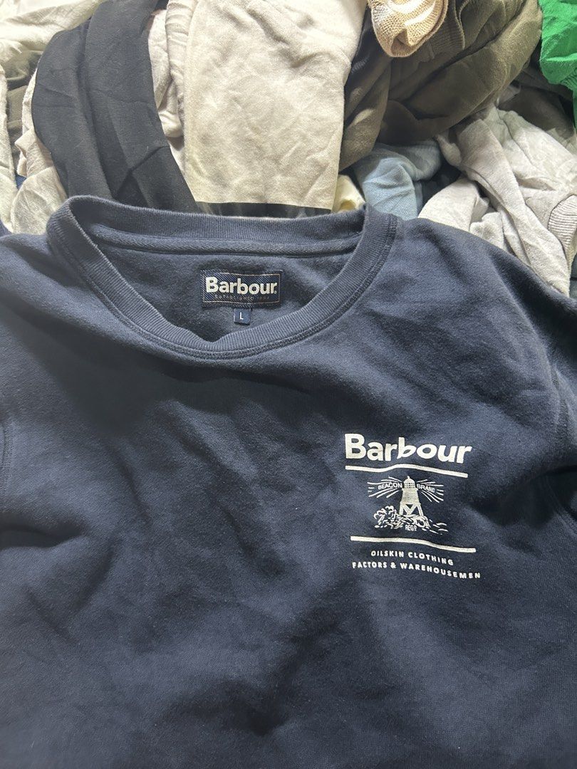 Barbour Reed Crew Sweatshirt Navy Size L (Category: Coats, Jackets and Outerwear) located in Manila. Submitted by andotputla37237 (Listing ID 1463335166, Image 3). Description: - Navy blue Barbour Reed Crew sweatshirt - Size: L - Features classic Barbour logo and graphic on chest and back - Material: Cotton and polyester blend - Ideal for casual wear.