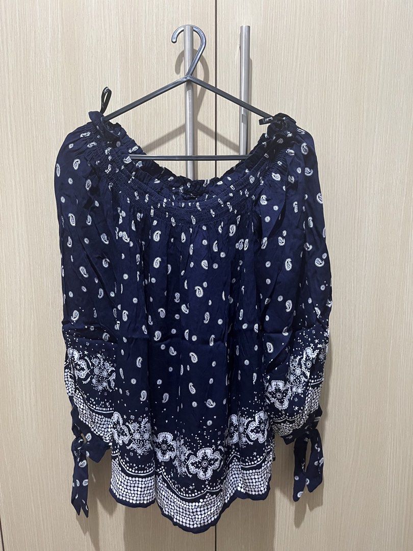 Bardot Navy Paisley Off-Shoulder Top (Category: Blouses) located in Manila. Submitted by r.ruth (Listing ID 1463551879, Image 1). Description: 🔸Off-shoulder style 🔹 Smocked neckline and cuffs 🔸 Long sleeves with tie details 🔹 Brand New with Tag 🔸RFS: Impulse buy 🚚 For same day delivery via Grab or Lalamove. Shipping Fee EXCLUDED..