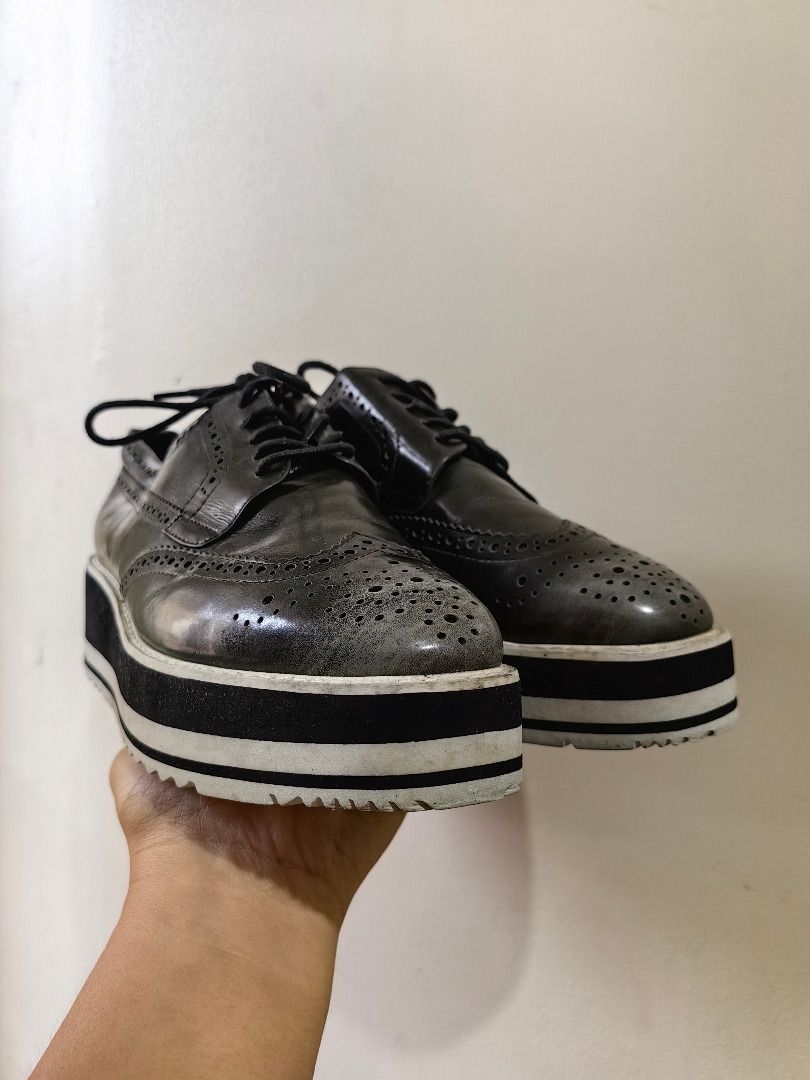 Bata Wingtip Platform Oxfords Brogues Shoes (Category: Loafers) located in Tarlac. Submitted by jeremiah.curator.2026 (Listing ID 1463551876, Image 2). Description: - Black Bata wingtip oxfords - Size 235 - Brogue detailing - Lace-up closure - Platform sole with white and black striped detail - Adds an edgy touch to any outfit.