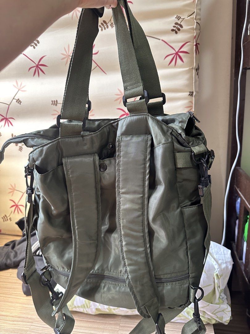 Beabi Green Nylon Multi-Pocket Shoulder Bag/Backpack (Category: Backpacks) located in Valenzuela. Submitted by shopwithmika (Listing ID 1463373252, Image 2). Description: - Brand: Beabi - Material: Nylon - Color: Green - Features: Multiple front pockets for easy access, convertible shoulder bag/backpack straps - Main Compartment: Includes internal pockets - Ideal for: Everyday use.