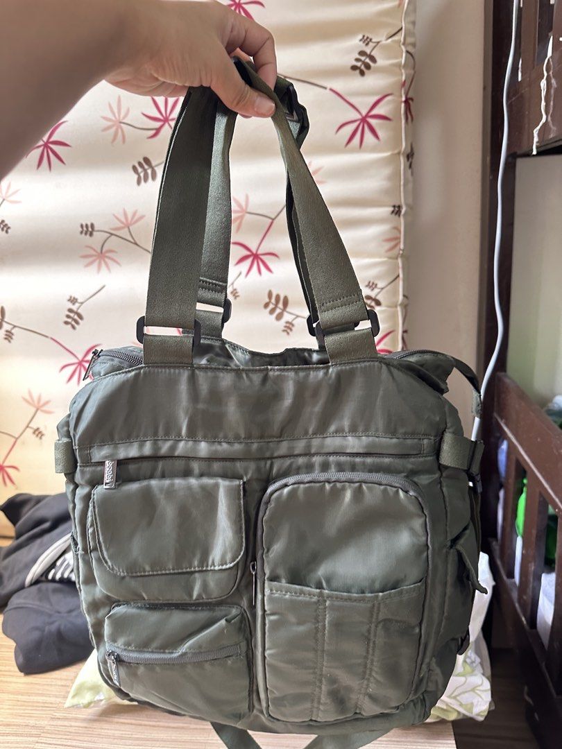 Beabi Green Nylon Multi-Pocket Shoulder Bag/Backpack (Category: Backpacks) located in Valenzuela. Submitted by shopwithmika (Listing ID 1463373252, Image 1). Description: - Brand: Beabi - Material: Nylon - Color: Green - Features: Multiple front pockets for easy access, convertible shoulder bag/backpack straps - Main Compartment: Includes internal pockets - Ideal for: Everyday use.