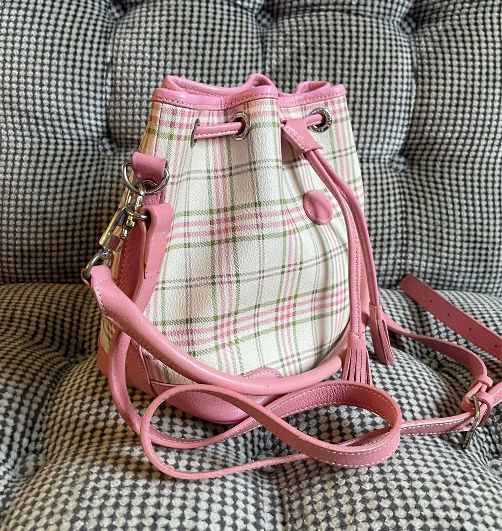 Bean pole plaid bag (Category: Cross-body Bags) located in Bulacan. Submitted by thriftbagcollections (Listing ID 1463439694, Image 3). Description: - Adorable pink plaid bucket bag - White base with a charming pink and green plaid pattern - Stylish pink leather trim and details - Secure drawstring closure with decorative tassels - Includes a convenient top handle - Comes with a long, adjustable strap for versatile carrying - Spacious interior, i