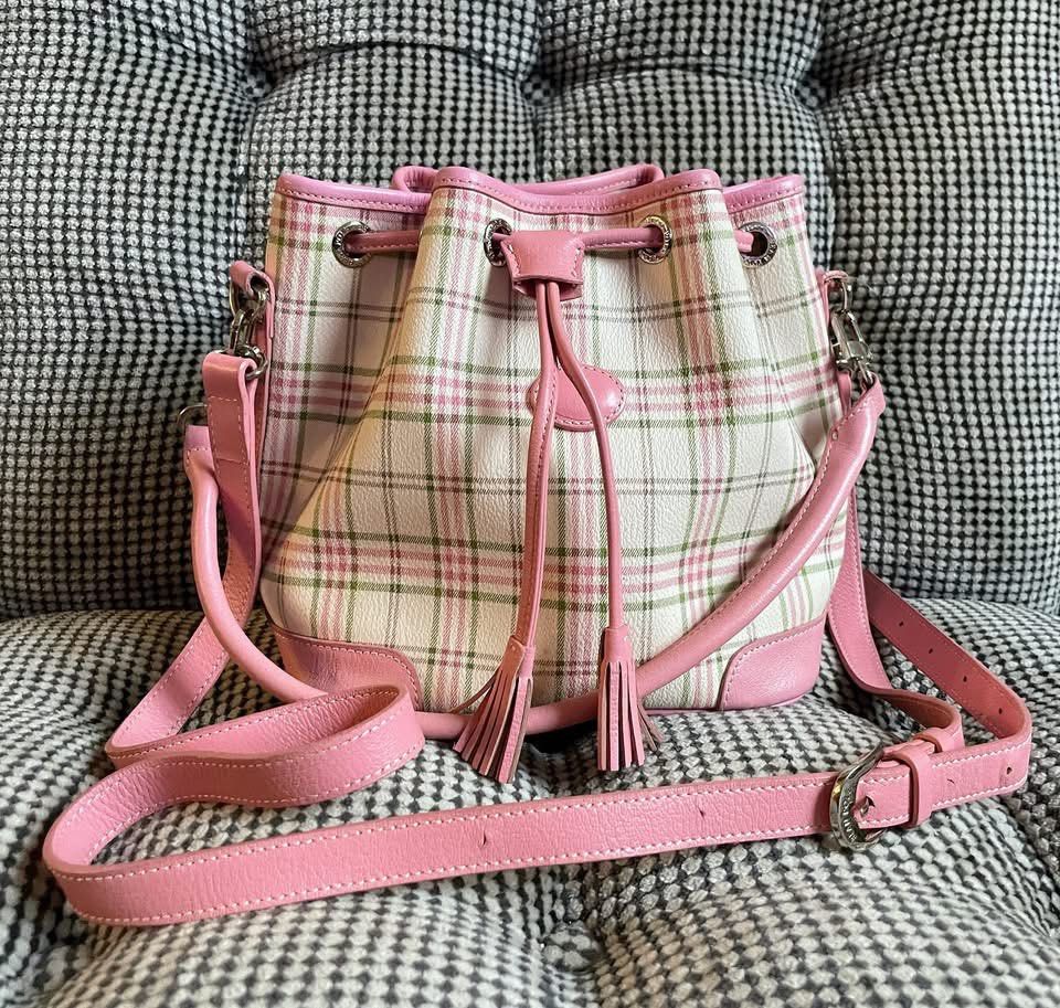 Bean pole plaid bag (Category: Cross-body Bags) located in Bulacan. Submitted by thriftbagcollections (Listing ID 1463439694, Image 1). Description: - Adorable pink plaid bucket bag - White base with a charming pink and green plaid pattern - Stylish pink leather trim and details - Secure drawstring closure with decorative tassels - Includes a convenient top handle - Comes with a long, adjustable strap for versatile carrying - Spacious interior, i