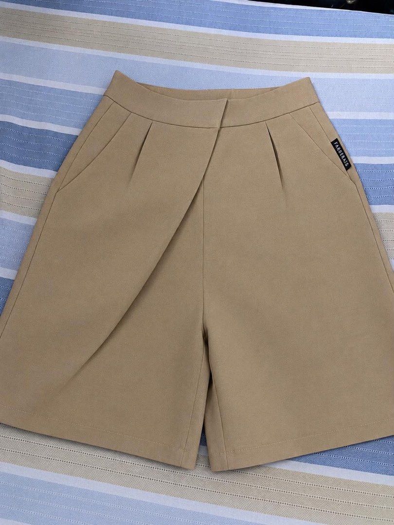 Beige high-waisted tailored shorts (Category: Shorts) located in Manila. Submitted by _auraq11 (Listing ID 1463193389, Image 1). Description: features an asymmetrical crossover front detail 12 inch waist 18 inch long.