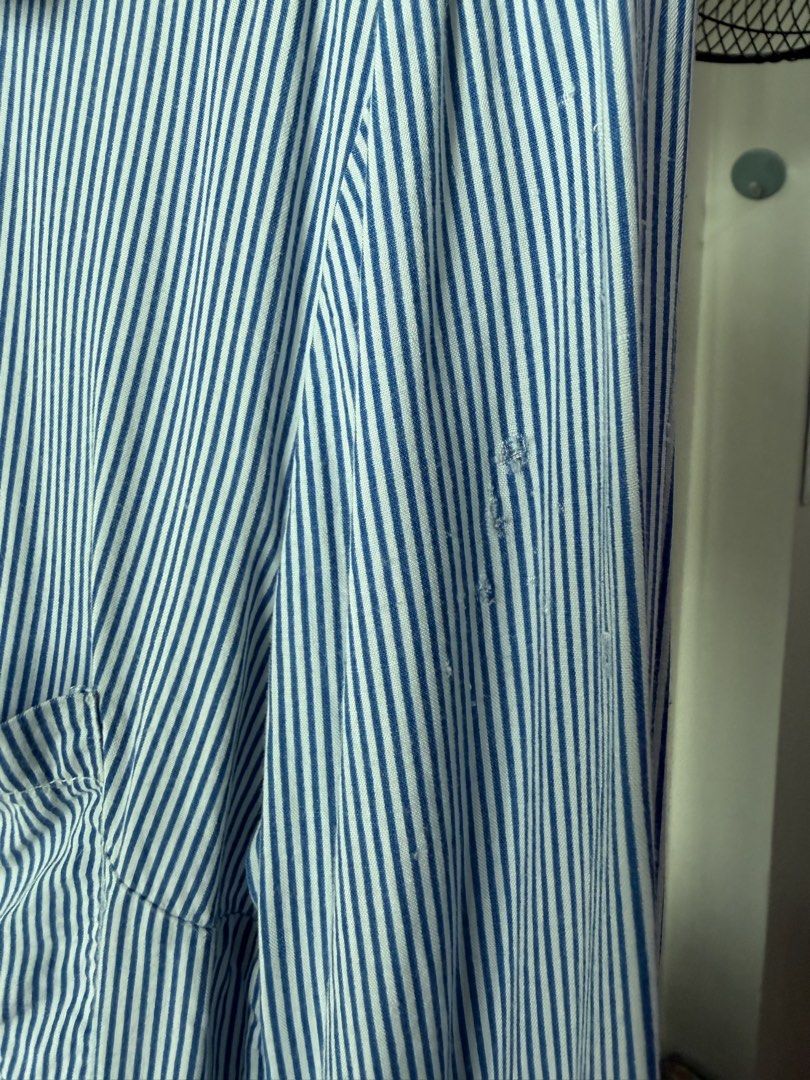 Bershka Striped Button-Up Shirt (Category: Shirts) located in Caloocan City. Submitted by favestop (Listing ID 1463460362, Image 3). Description: - Bershka blue and white striped long-sleeved shirt - fits XS-M - Button-up front closure - with minimal pinholes on the shoulder.