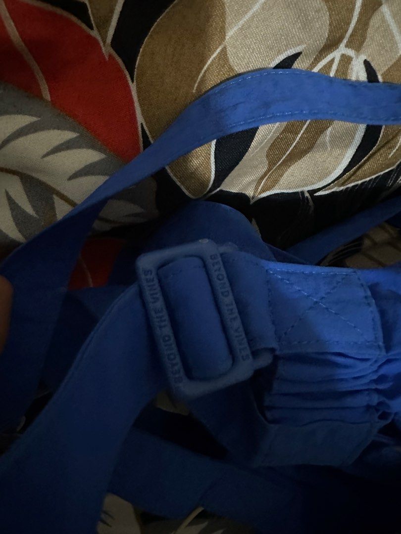 Beyond The Vines — Micro Dumpling / Cobalt Blue (Category: Cross-body Bags) located in Angeles City. Submitted by iybebng (Listing ID 1463546271, Image 3). Description: - Micro Dumpling Bag from Beyond The Vines - Cobalt Blue 8/10 Condition / Authentic - Made of 100% Nylon - Features a front pocket - Adjustable straps for comfort - Brand name visible on strap buckle and front pocket - Ideal for everyday use.