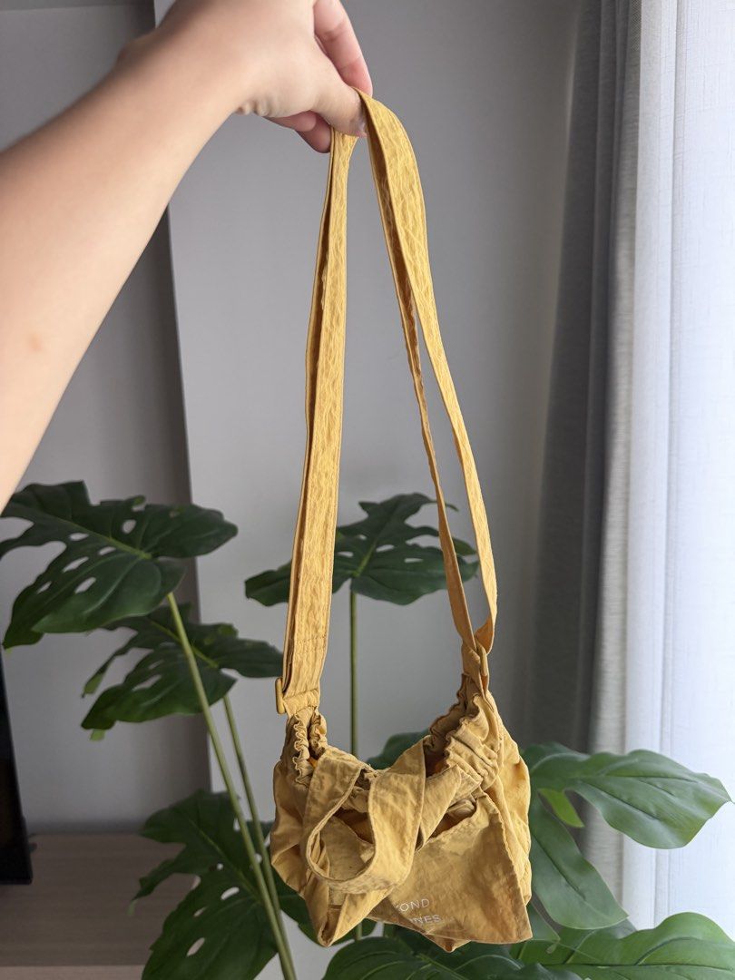 Beyond The Vines Micro Dumpling Bag (Category: Tote Bags) located in Paranaque City. Submitted by declutterwithrs (Listing ID 1463551369, Image 1). Description: - Brand: Beyond The Vines - Color: Yellow.