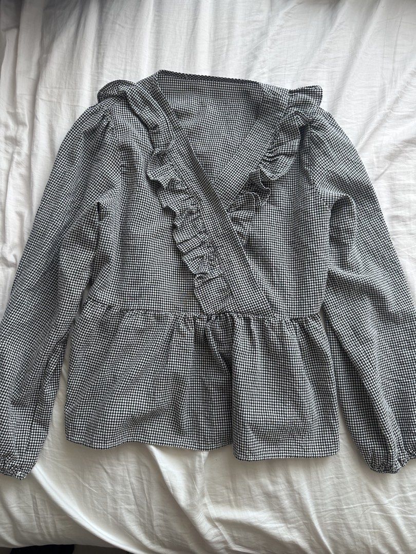 Black and White Gingham Ruffle Peplum Blouse (Category: Blouses) located in Taguig. Submitted by beatrizangela (Listing ID 1463390799, Image 2). Description: - Cute black and white gingham pattern - Ruffled neckline and front - Peplum style - Long sleeves - Easy to dress up or down - Perfect for any occasion.