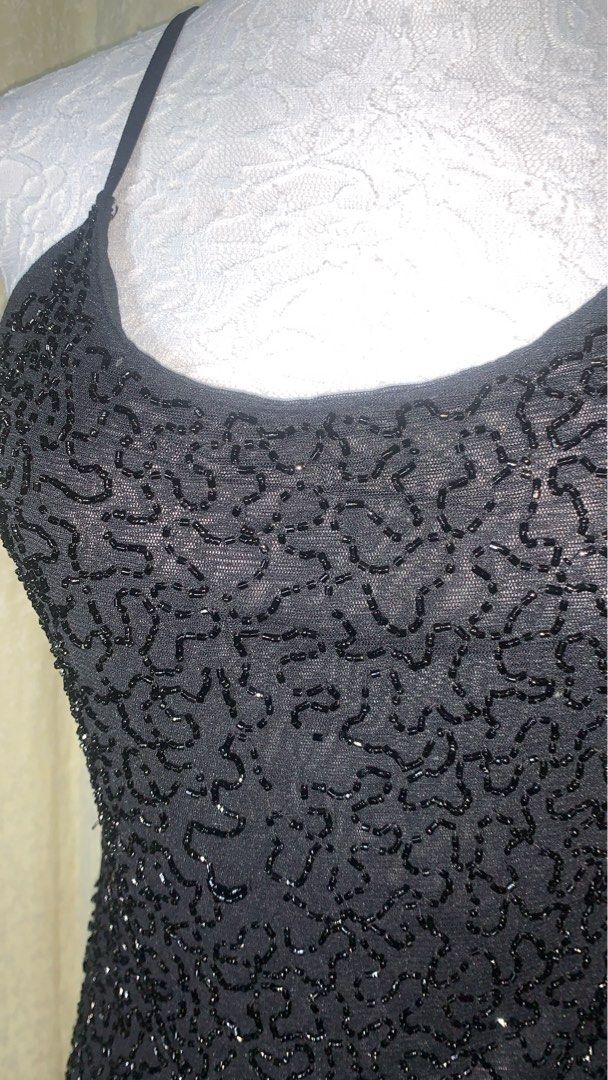 Black Beaded Sheer Camisole Top (Category: Sleeveless) located in Dagupan City. Submitted by sj_styles0910. (Listing ID 1463533325, Image 2). Description: - Black sheer camisole - All-over intricate beading that catches the light - Delicate spaghetti straps - Perfect for layering over bralettes or tops - Ideal for night outs or special occasions - Very chic and eye-catching.