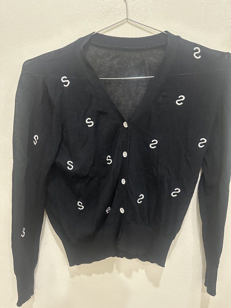 Black Button-Up Cardigan with 'S' Pattern Small to Medium (Category: Coats, Jackets and Outerwear) located in Manila. Submitted by roseluxuryitems (Listing ID 1463471205, Image 2). Description: - Black knit cardigan - Repeating white 'S' pattern all over - V-neckline with button-up front - Long sleeves with ribbed cuffs - Slightly sheer knit - Ideal for layering.