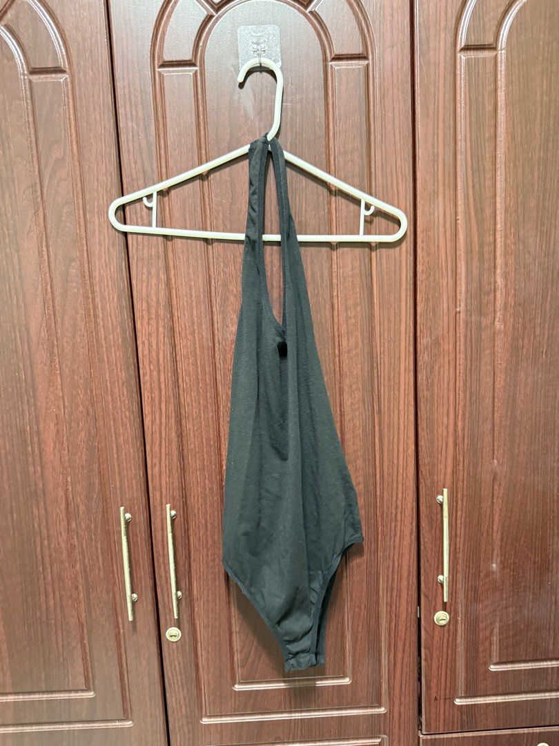 Black Halter Neck Bodysuit (Category: Others Tops) located in Bulacan. Submitted by aubreyangelieee (Listing ID 1463441162, Image 1). Description: - Chic black halter neck bodysuit - Made with soft, comfortable fabric - Flattering and fits beautifully - Perfect for layering or wearing solo - Highly versatile styling options.
