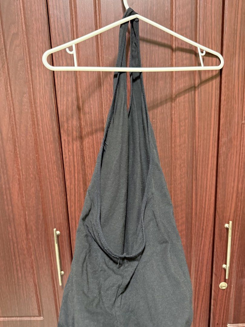 Black Halter Neck Bodysuit (Category: Others Tops) located in Bulacan. Submitted by aubreyangelieee (Listing ID 1463441162, Image 2). Description: - Chic black halter neck bodysuit - Made with soft, comfortable fabric - Flattering and fits beautifully - Perfect for layering or wearing solo - Highly versatile styling options.