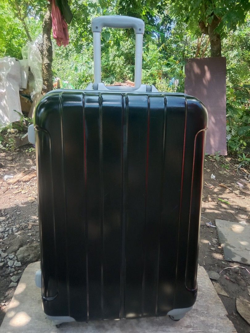 Black Hardshell Luggage (Category: Luggage) located in Muntinlupa City. Submitted by surplus.faithenasha.2930 (Listing ID 1463356983, Image 3). Description: - Sleek black hard shell rolling suitcase - Extendable handle for effortless maneuvering - Interior straps to keep your belongings secure - Smooth-gliding wheels for easy transport - Perfect for all your travel needs - Boarding Brand - Authentic from Japan we ship nationwide price is negotiab