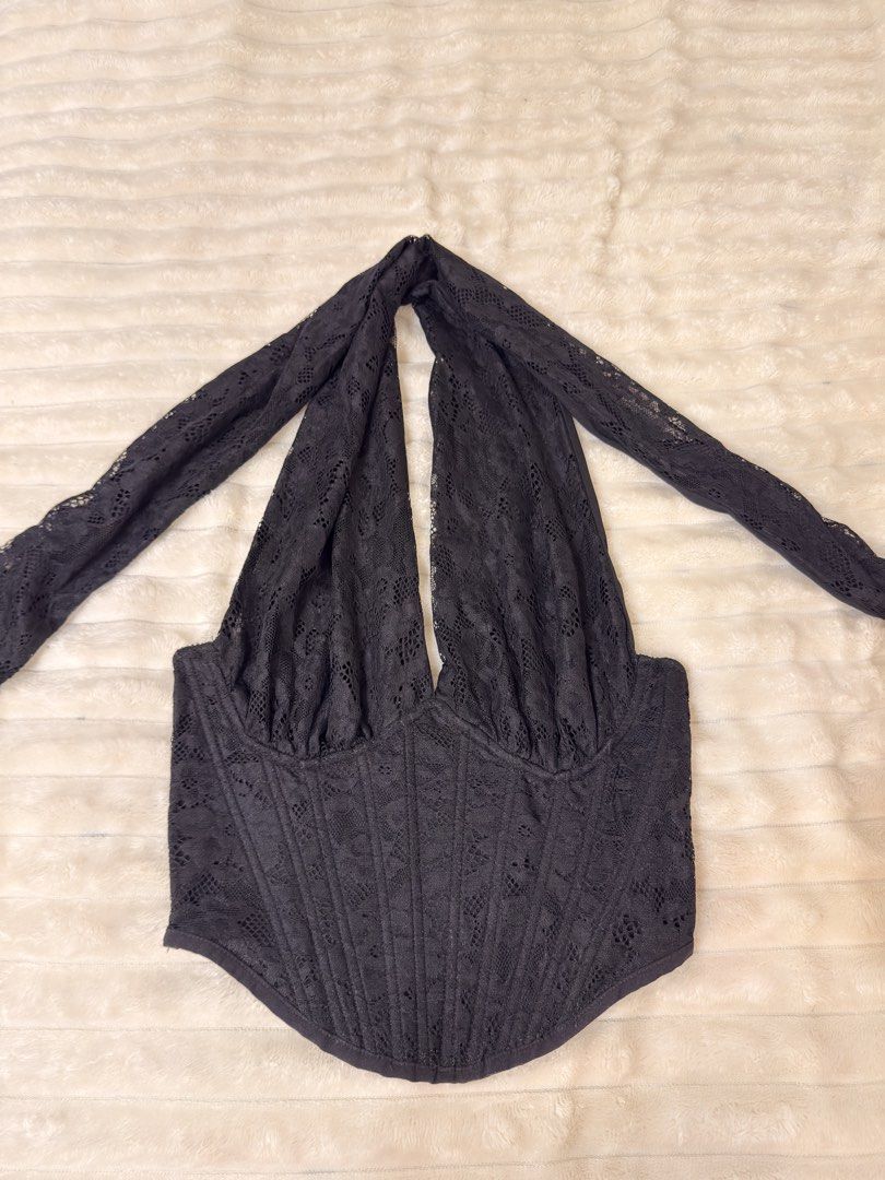 Black Lace Halter Corset Top (Category: Sleeveless) located in Rizal. Submitted by rianaht (Listing ID 1463399827, Image 1). Description: Elegant black lace halter top - Medium to Large - Never used with tag - Corset-style bodice for a flattering fit - Adjustable tie straps at the neck and back - Beautiful floral lace pattern - Convenient side zipper closure 🌸 RFS: Decluttering 🌸 Delivery only to be shouldered by the buyer. 🌸 Payment via GCash