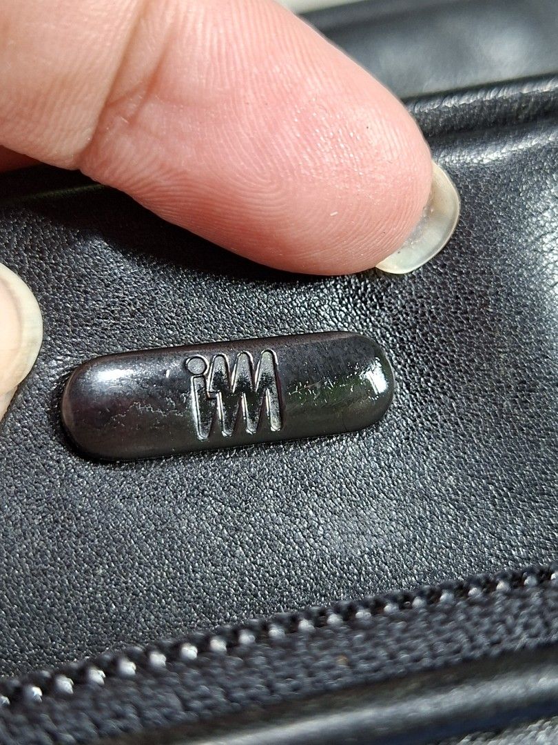 Black Leather Bag with Strap (Category: Luxury Bags & Wallets) located in Lucena. Submitted by dai_suki (Listing ID 1463475995, Image 3). Description: - Genuine black leather bag - Detachable shoulder strap with metal clasps - 'IM' logo on zippers - Ideal size for everyday essentials - Interior is clean and well-maintained - Shows minor signs of wear on the strap and hardware.