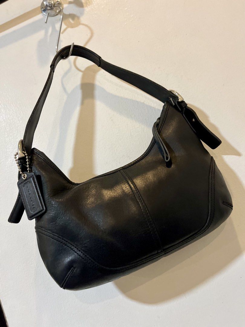 Black Leather Coach Hobo Shoulder Bag (Category: Luxury Bags & Wallets) located in Bacolod City. Submitted by vintage_vogue6100 (Listing ID 1463386113, Image 1). Description: - Classic black leather Coach hobo bag - Soft leather with stitching details - Silver hardware and buckle on the strap - Includes Coach leather hangtag - Timeless shoulder bag style - Great for everyday use.