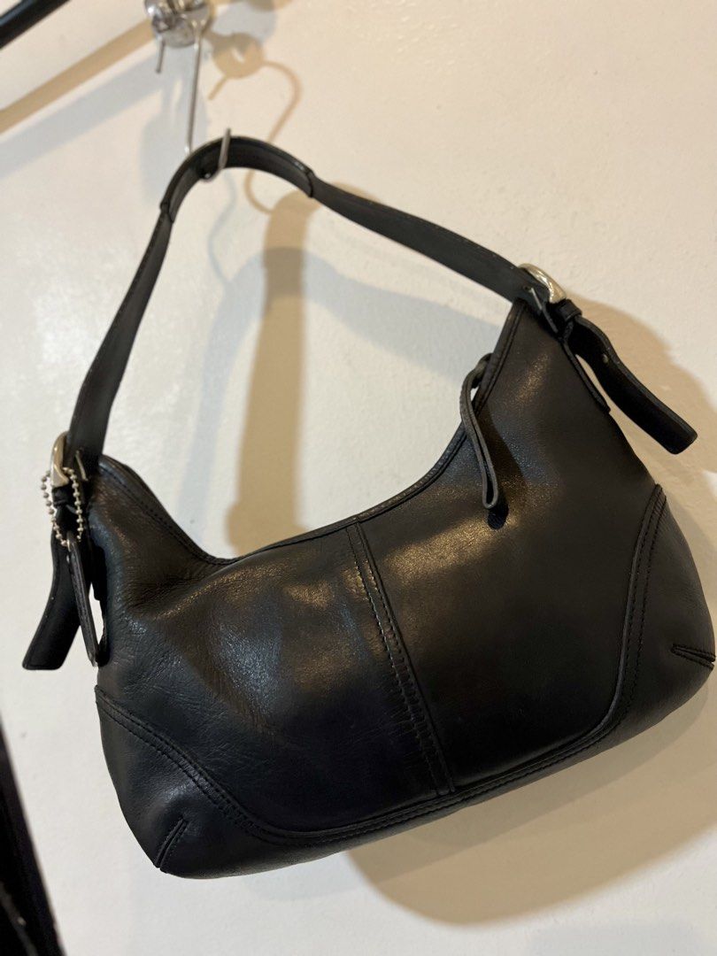 Black Leather Coach Hobo Shoulder Bag (Category: Luxury Bags & Wallets) located in Bacolod City. Submitted by vintage_vogue6100 (Listing ID 1463386113, Image 3). Description: - Classic black leather Coach hobo bag - Soft leather with stitching details - Silver hardware and buckle on the strap - Includes Coach leather hangtag - Timeless shoulder bag style - Great for everyday use.