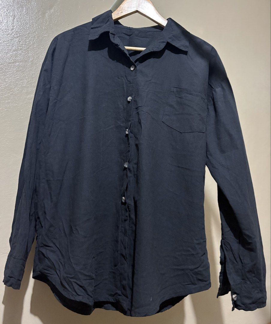 Black Long Sleeve Button-Up Shirt (Category: Tshirts & Polo Shirts ) located in Manila. Submitted by stella_mari27 (Listing ID 1463457731, Image 1). Description: - Classic black button-up shirt - Chest pocket - Long sleeves with button cuffs - Breathable fabric (likely linen or blend) - Versatile for casual or smart-casual outfits - Easy to pair with any bottoms.