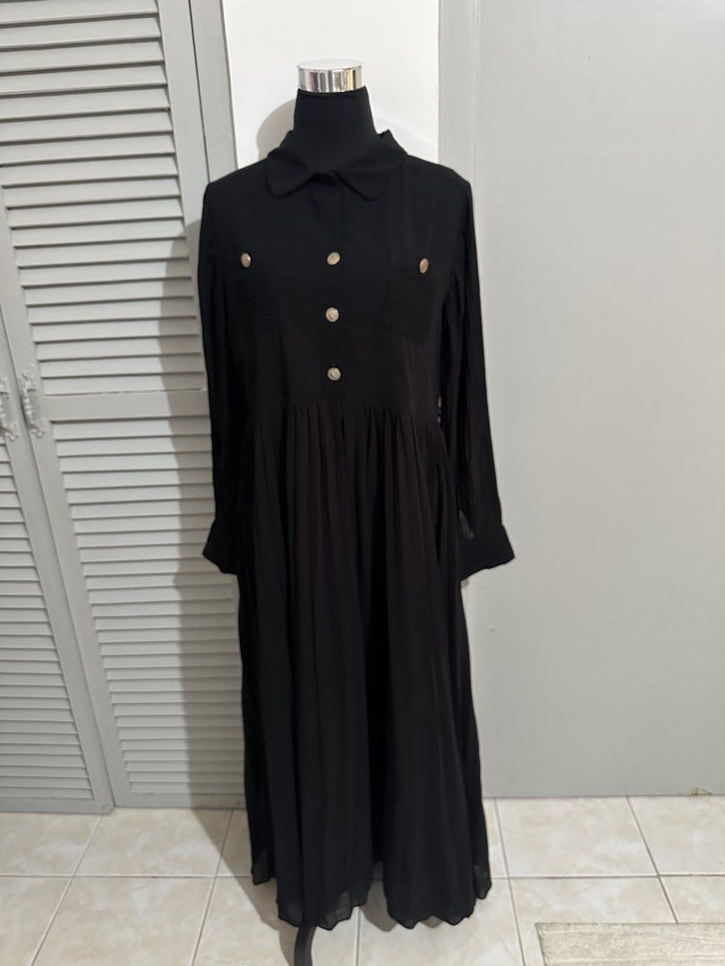 Black Long Sleeve Collared Midi Dress (Category: Dresses) located in Subic. Submitted by ruffa_assorted_item (Listing ID 1463367493, Image 1). Description: - Black midi dress - Long sleeves - Collared neckline - Button-up front - Pleated, flowy skirt - Estimated size: Medium - Versatile for casual or semi-formal occasions.