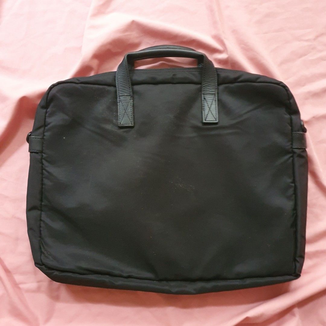 Black Nylon Laptop Bag with Leather Handles (Category: Belt bags, Clutches and Pouches) located in Paranaque City. Submitted by cobien (Listing ID 1463458669, Image 2). Description: - Durable black nylon laptop bag - Dimensions: 16 x 12.25 x 2.5 inches - Comfortable leather handles - Multiple interior pockets for organization - Zippers in excellent working condition - genuine leather handle - has flaw on the leather part - outside needs clean - I