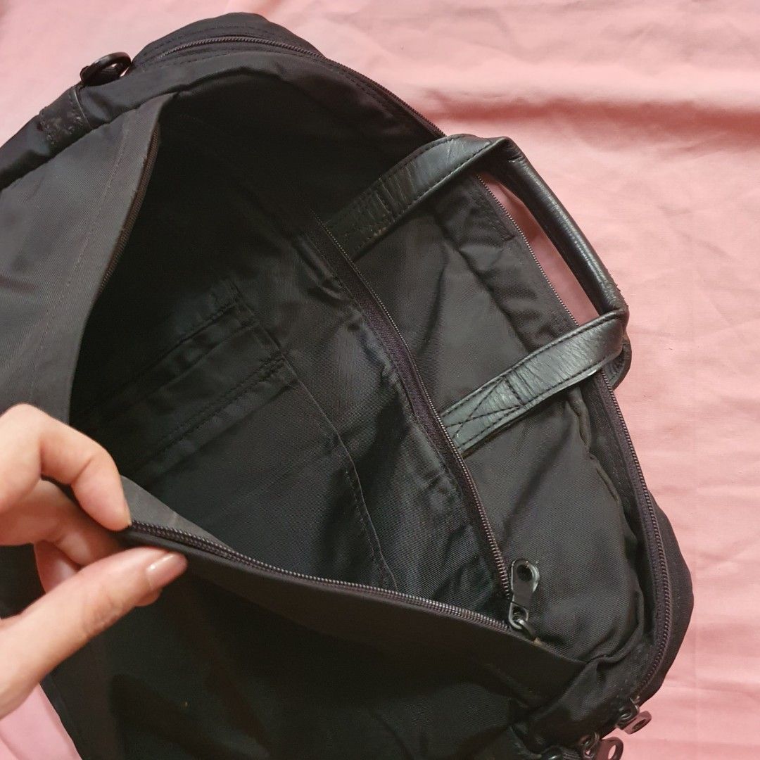 Black Nylon Laptop Bag with Leather Handles (Category: Belt bags, Clutches and Pouches) located in Paranaque City. Submitted by cobien (Listing ID 1463458669, Image 3). Description: - Durable black nylon laptop bag - Dimensions: 16 x 12.25 x 2.5 inches - Comfortable leather handles - Multiple interior pockets for organization - Zippers in excellent working condition - genuine leather handle - has flaw on the leather part - outside needs clean - I