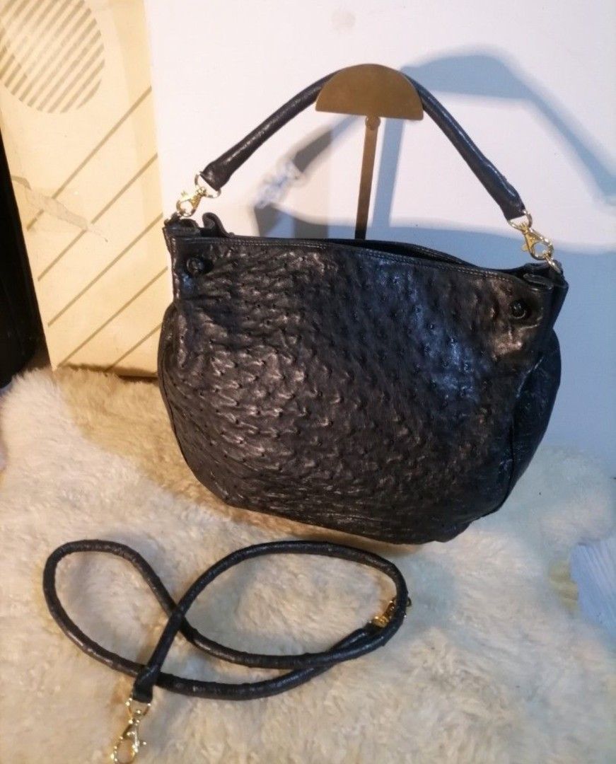 Black Ostrich Leather Shoulder Bag with Detachable Strap (Category: Shoulder Bags) located in Legazpi City. Submitted by fhlorms (Listing ID 1463429403, Image 1). Description: Chic black leather shoulder bag with a unique ostrich texture. Features a main compartment, two top handles, and a detachable crossbody strap. Accented with gold hardware. Perfect for day or night..