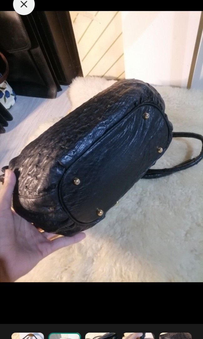 Black Ostrich Leather Shoulder Bag with Detachable Strap (Category: Shoulder Bags) located in Legazpi City. Submitted by fhlorms (Listing ID 1463429403, Image 2). Description: Chic black leather shoulder bag with a unique ostrich texture. Features a main compartment, two top handles, and a detachable crossbody strap. Accented with gold hardware. Perfect for day or night..