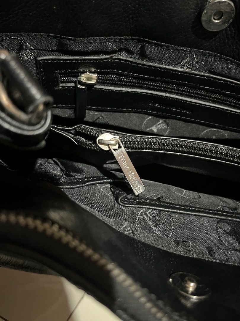 Black Quilted Tote Bag with Silver Hardware (Category: Tote Bags) located in Caloocan City. Submitted by decluttering_1tems (Listing ID 1463530633, Image 2). Description: - Stylish black quilted tote bag - Convenient front pocket - Secure zippered main compartment - Interior pockets for easy organization - Durable straps with elegant silver hardware - Ideal size for everyday use.