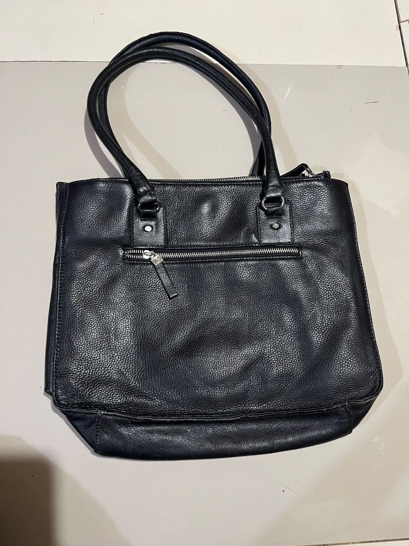 Black Quilted Tote Bag with Silver Hardware (Category: Tote Bags) located in Caloocan City. Submitted by decluttering_1tems (Listing ID 1463530633, Image 3). Description: - Stylish black quilted tote bag - Convenient front pocket - Secure zippered main compartment - Interior pockets for easy organization - Durable straps with elegant silver hardware - Ideal size for everyday use.