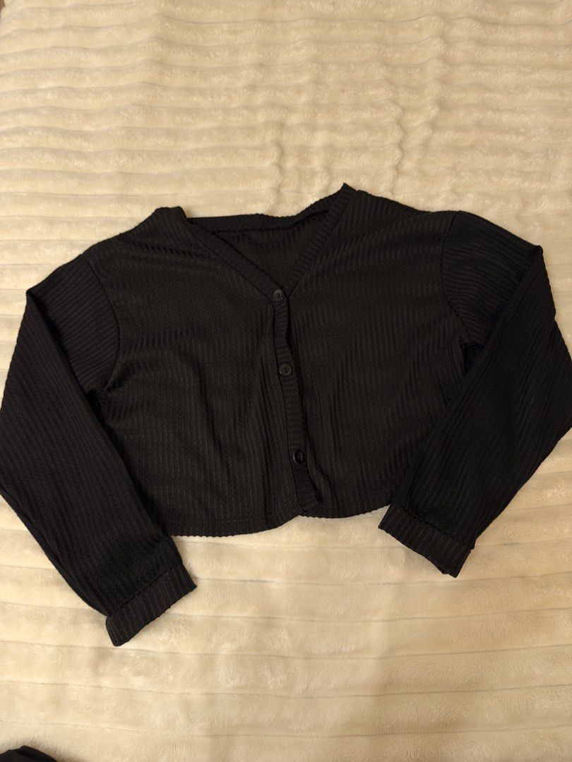 Black Ribbed Cropped Cardigan (Category: Coats, Jackets and Outerwear) located in Rizal. Submitted by rianaht (Listing ID 1463404554, Image 2). Description: Black ribbed cropped cardigan - Can fit Medium to Large 🌸 RFS: Decluttering 🌸 Delivery only to be shouldered by the buyer. 🌸 Payment via GCash / Maya / Maribank.