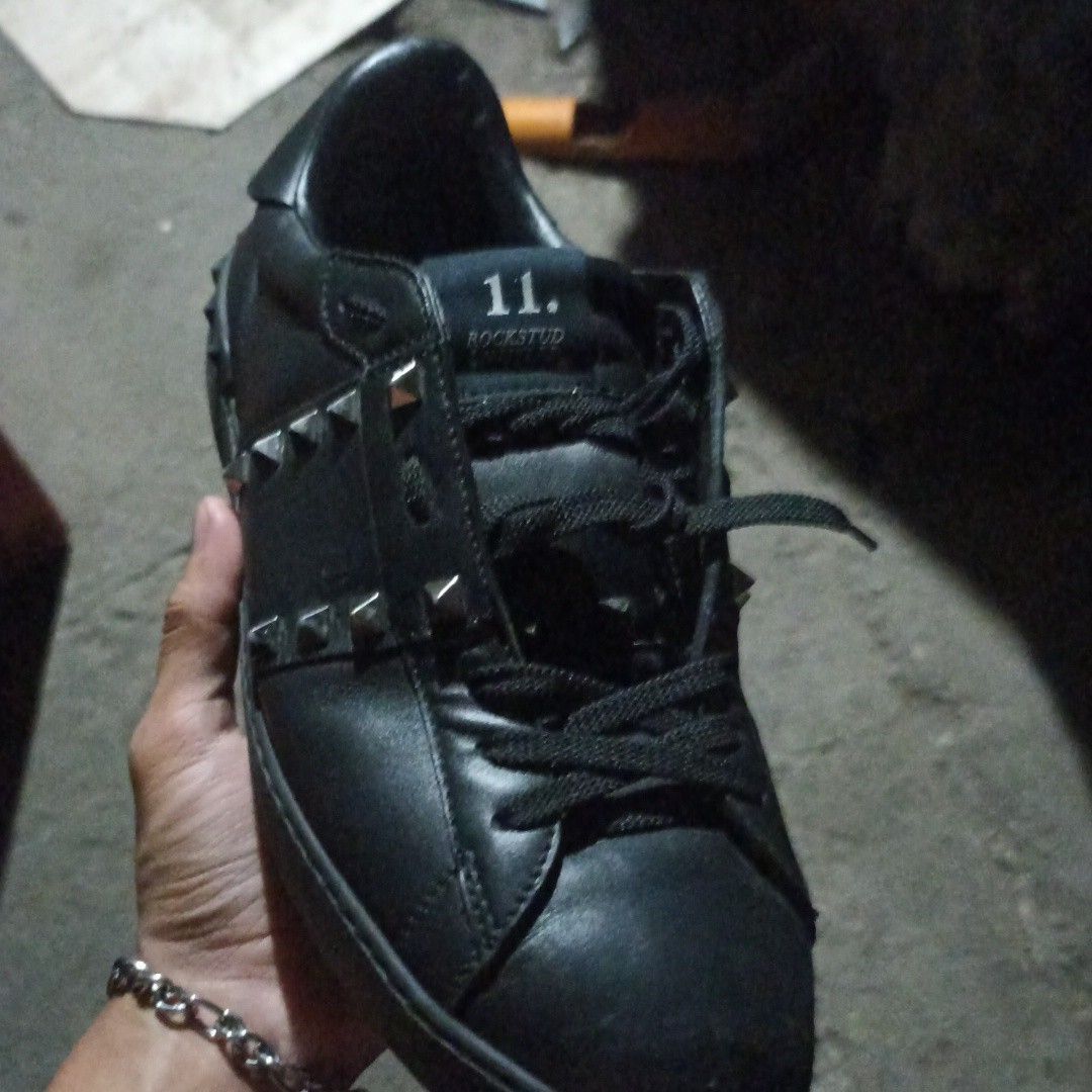 Black Rockstud Sneakers with Silver Studs (Category: Casual Shoes) located in Manila. Submitted by silentturtle_0a14ba (Listing ID 1463497212, Image 1). Description: - Black lace-up sneakers - Features silver stud details - '11. ROCKSTUD' printed on the tongue - Ideal for stylish casual wear - Pre-loved and ready for a new owner.