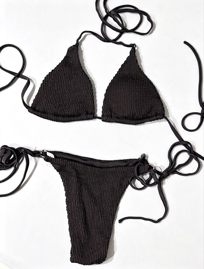 Black Textured Triangle Bikini Set (Category: Bikinis & Swimsuits) located in Manila. Submitted by declutterwith_nics (Listing ID 1463377615, Image 1). Description: - Black textured bikini set - Triangle top with adjustable tie straps - Matching bottoms with adjustable tie sides - Comfortable and stylish for beach or pool - Ideal for tanning and beach trips.