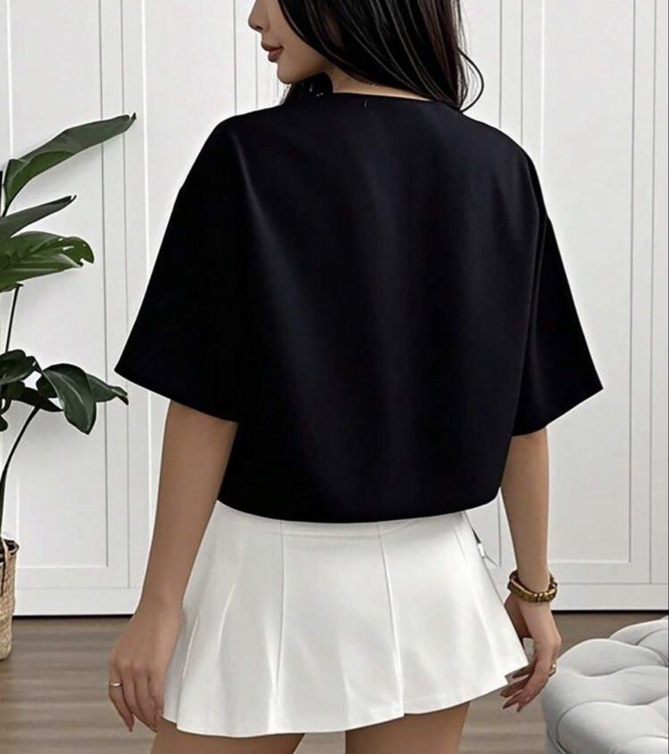 Black Tie Front Cropped Top (Category: Blouses) located in Manila. Submitted by fashionfinds21 (Listing ID 1463399830, Image 2). Description: - Cute black cropped top - Features a tie front detail - Short sleeves and V-neckline - Versatile for casual or night out looks - Easy to style with high-waisted bottoms.