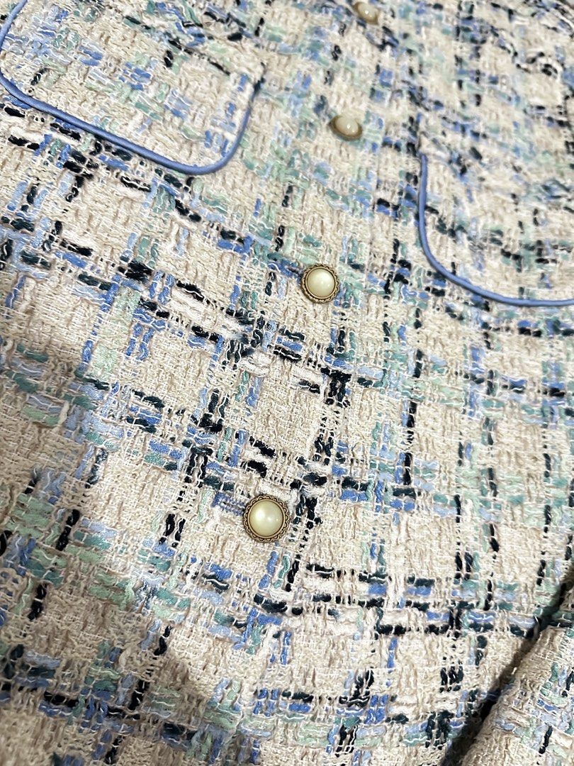Blue & White Tweed Jacket with Pearl Buttons (Category: Coats, Jackets and Outerwear) located in Manila. Submitted by everythingsale101 (Listing ID 1463478191, Image 2). Description: - Cute tweed jacket - Blue and white checkered pattern - Two front pockets - Pearl-like buttons - Light blue lining - Versatile for layering over tops or dresses - Pairs well with jeans or dress pants -Needs washing Fits M-L up to 38 bust —Premium tweed blazers bundl