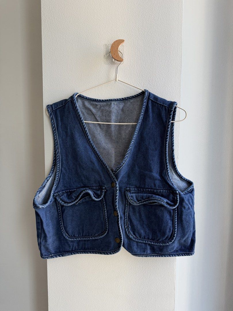 Blue Denim Vest with Pockets (Category: Sleeveless) located in Makati City. Submitted by ariannelaz54133 (Listing ID 1463553575, Image 1). Description: - Classic blue denim vest - Two front pockets with button closures - V-neckline - Button-up front - Versatile layering piece.