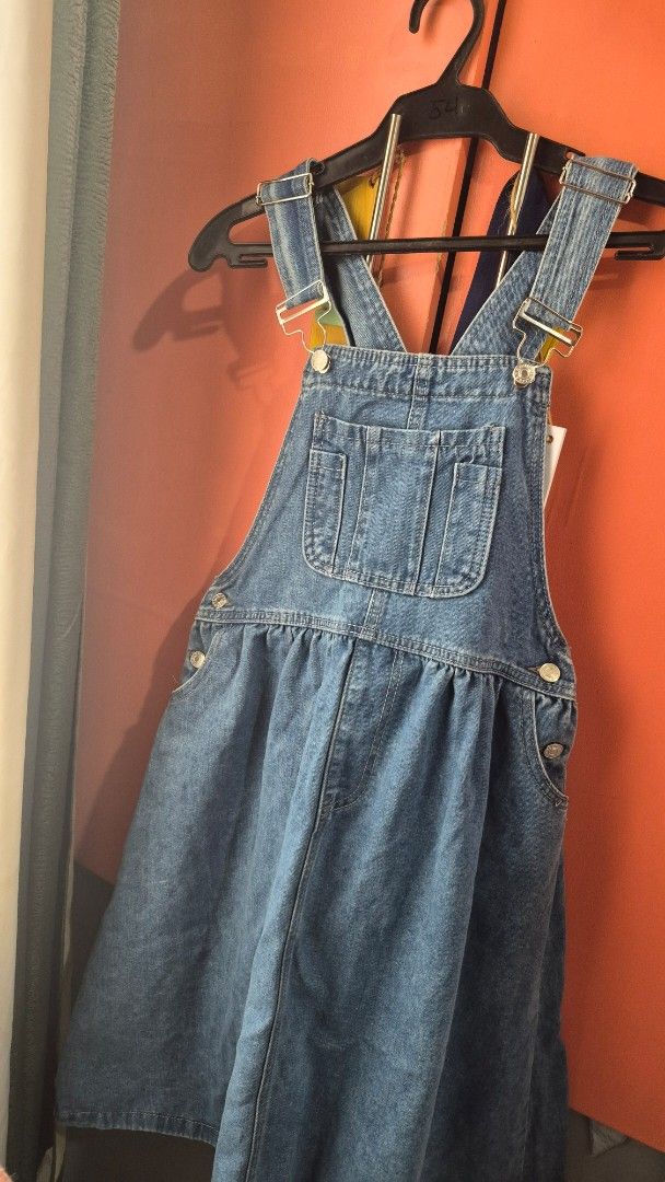 Blue Jumper Denim (Category: Jumpsuits) located in Imus. Submitted by shopestepanimey (Listing ID 1463331375, Image 1). Description: - Washed but never worn - Classic blue denim overalls - Adjustable buckle straps - Convenient bib pocket - Gathered waist detail - Perfect for a casual and stylish outfit - Versatile and easy to pair with different tops.