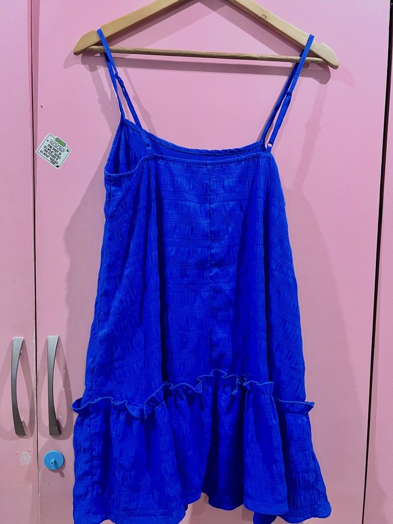 Blue Textured Spaghetti Strap Ruffle Dress (Category: Dresses) located in Manila. Submitted by purgeout (Listing ID 1463552774, Image 1). Description: - Adorable blue dress with a unique textured fabric. - Features delicate spaghetti straps. - Stylish ruffled hem for a playful touch. - Ideal for casual days or beach getaways. - Effortless to wear and versatile for styling. - Pairs well with sandals or sneakers..