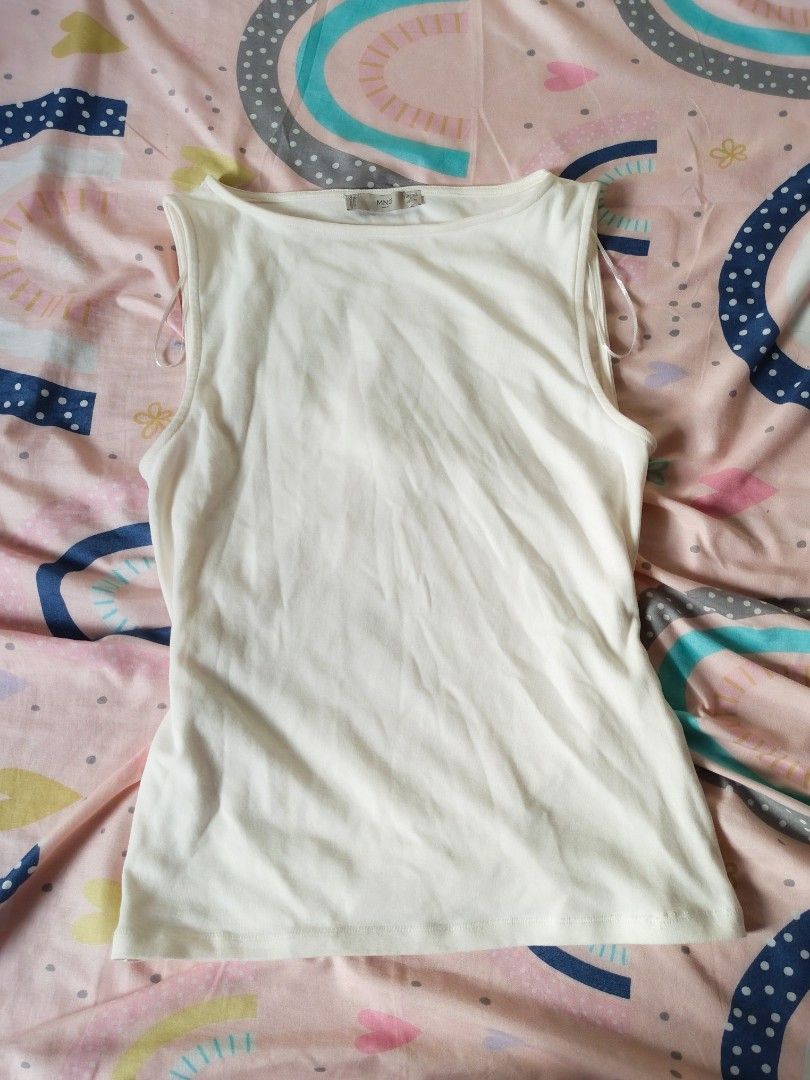 Boat Neck White Top (Category: Sleeveless) located in Maragondon. Submitted by wynne.picks (Listing ID 1463434735, Image 2). Description: SALE ONLY! FIRST TO PAY GETS THE ITEM ❤️ MNG brand fits medium issue - may maliit na mending na lower back part. di naman super noticeable overrun.