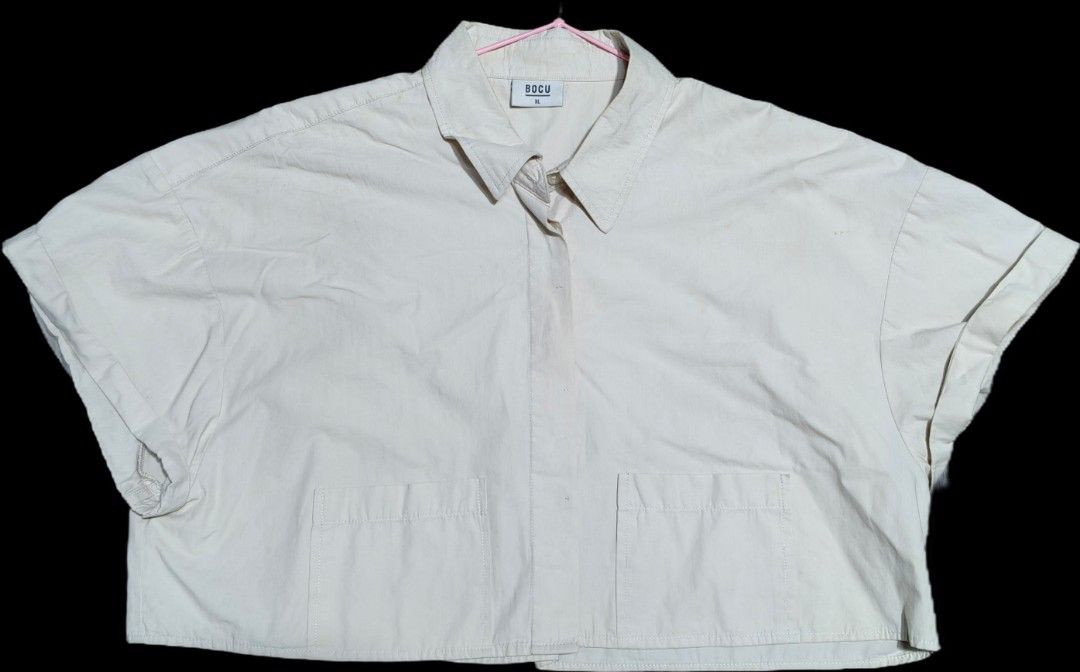 Bocu cropped polo shirt (Category: Shirts) located in Quezon City. Submitted by morningstar_52 (Listing ID 1463332763, Image 1). Description: - Brand: BOCU - Color: Beige - Style: Cropped shirt - Size: XL - Sleeves: Short with rolled cuffs - Pockets: Two front pockets - Closure: Button-up front - Occasion: Casual wear.