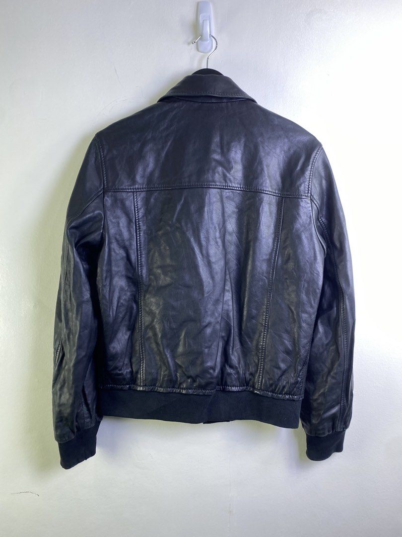 BOSS Hugo Boss Black Leather Bomber Jacket (Category: Coats, Jackets and Outerwear) located in Manila. Submitted by declutterpromax (Listing ID 1463402665, Image 3). Description: - BOSS Hugo Boss Black Leather Bomber Jacket - Genuine Leather - Classic Collar - Zip-up Front - Ribbed Cuffs and Hem - Two Front Pockets with Button Closure - Ideal for Layering.