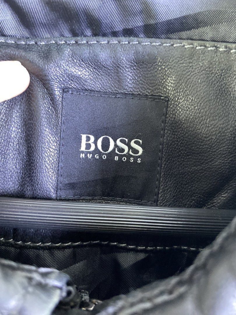 BOSS Hugo Boss Black Leather Bomber Jacket (Category: Coats, Jackets and Outerwear) located in Manila. Submitted by declutterpromax (Listing ID 1463402665, Image 2). Description: - BOSS Hugo Boss Black Leather Bomber Jacket - Genuine Leather - Classic Collar - Zip-up Front - Ribbed Cuffs and Hem - Two Front Pockets with Button Closure - Ideal for Layering.