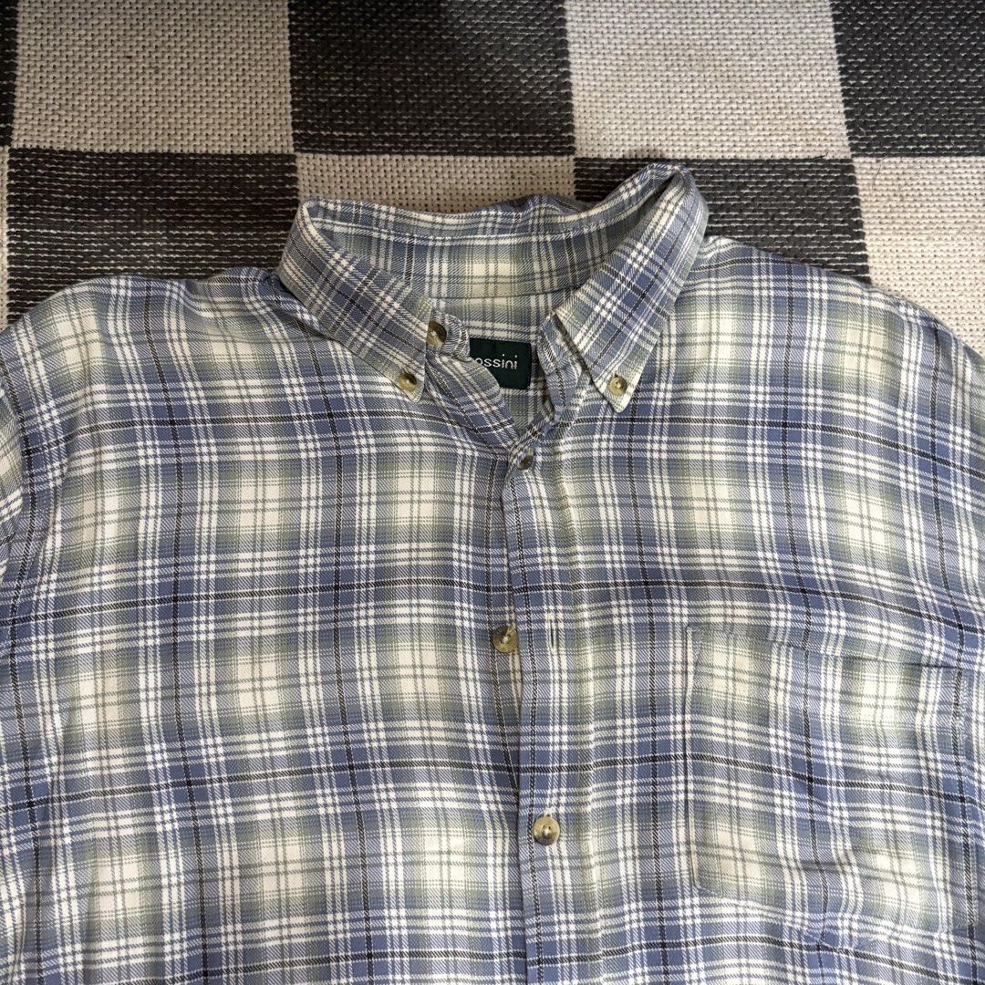 Bossini Plaid Button Down Short Sleeve Shirt (Category: Tshirts & Polo Shirts ) located in Makati City. Submitted by sseurekiii (Listing ID 1463347634, Image 2). Description: - Bossini short sleeve button down shirt - Classic plaid pattern in blue, white, and green - Features a chest pocket - Button collar for a neat look - Perfect for casual wear or layering.