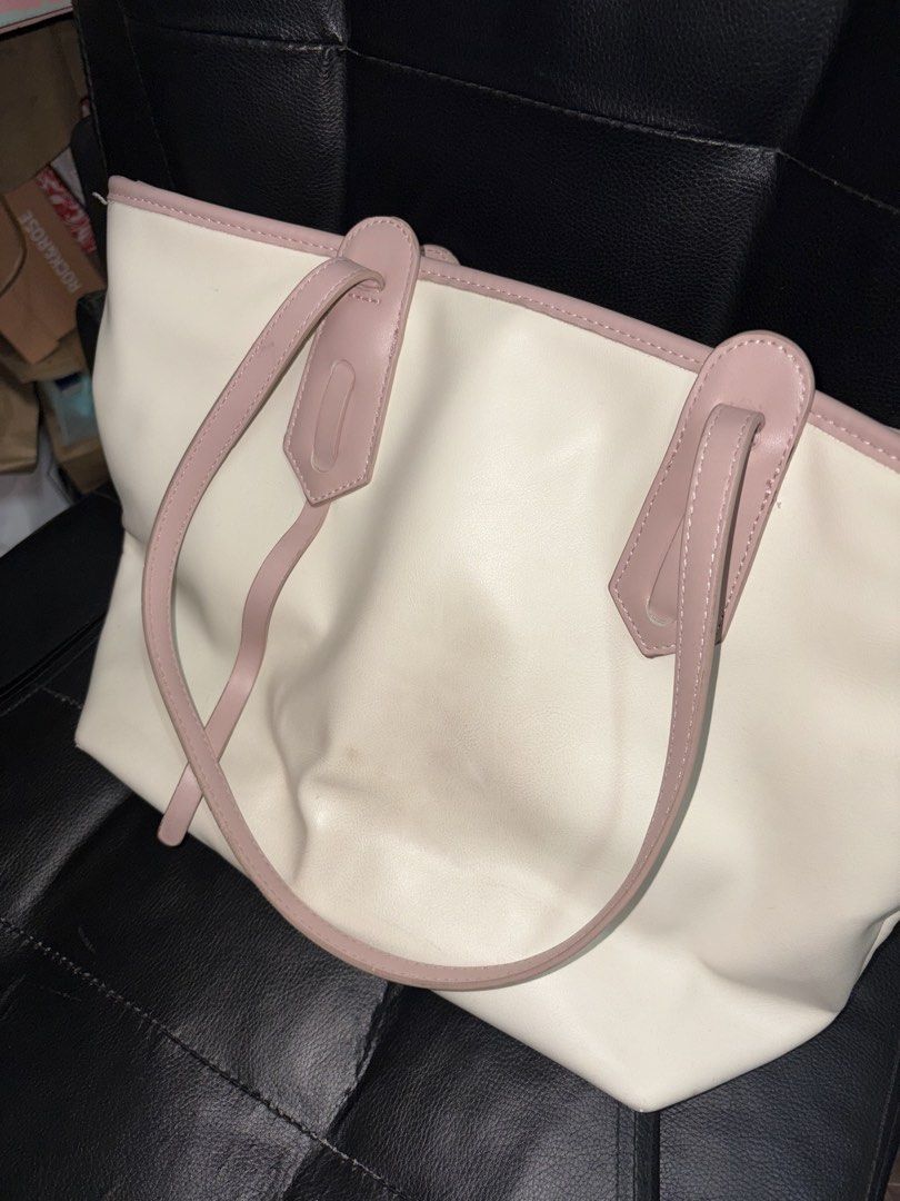 Bostanten Tote Bag (Category: Tote Bags) located in Manila. Submitted by rare_pretty_finds (Listing ID 1463440648, Image 3). Description: - Stylish cream tote bag with elegant pink trim and handles. - Spacious interior, ideal for everyday essentials. - Comfortable handles for easy carrying. - Versatile design suitable for school, work, or casual outings. 📍Quezon City.