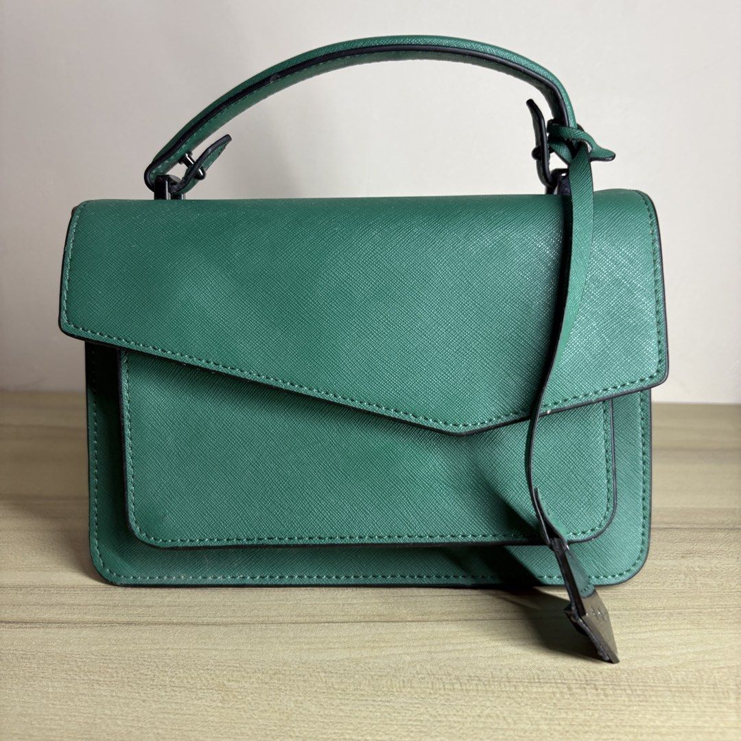 Botkier Green Handbag with Crossbody Strap (Category: Cross-body Bags) located in Angeles City. Submitted by muse_archive (Listing ID 1463432369, Image 3). Description: - Authentic Green Botkier Handbag - Detachable crossbody strap included - Convenient front flap pocket - Handy back slip pocket Ideal size for essentials.