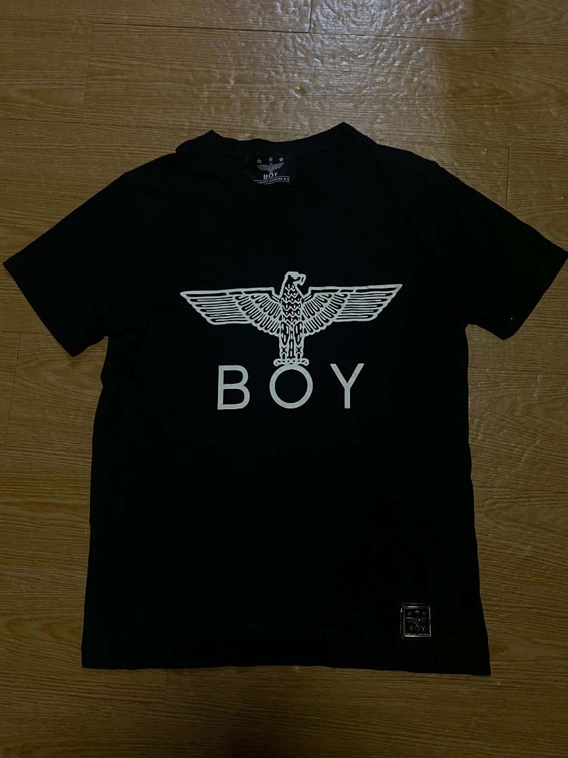 BOY London Eagle T-Shirt Black Size M (Category: Tshirts & Polo Shirts ) located in Manila. Submitted by re1n.findz (Listing ID 1463453708, Image 1). Description: - Authentic Black BOY London T-shirt - Features iconic eagle graphic and BOY logo - Size: Medium (M) - Made in the United Kingdom - Includes a small metal tag with 'HERITAGE SINCE 1976' - Perfect staple piece for any wardrobe.
