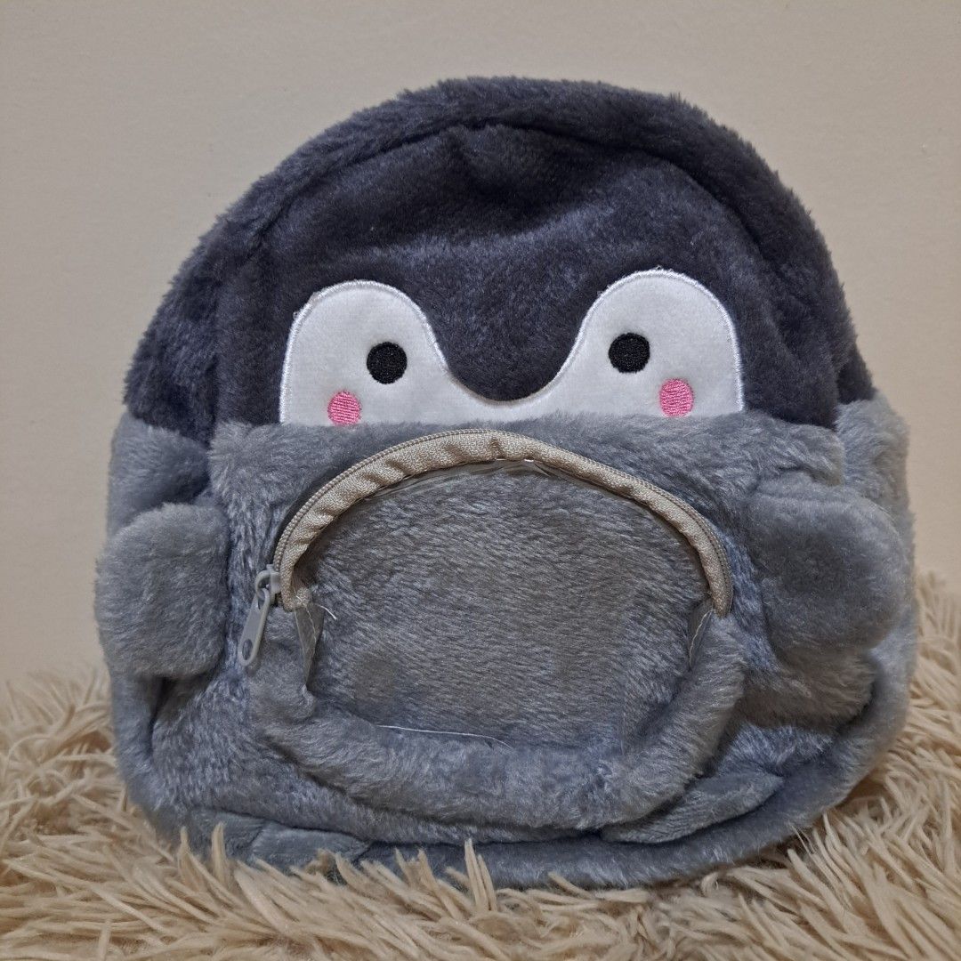 BRAND NEW! Penguin Backpack / Cute Plush Bag (Category: Babies & Kids Fashion) located in Taguig. Submitted by sooommessy (Listing ID 1463535555, Image 1). Description: - Adorable penguin design - Soft and plush material - Zipper closure for main compartment - Adjustable straps for a comfortable fit - 23 cm x 20 cm x 10 cm - Originally bought at 309php. Selling for 250php - RFS: Too large for the intended user.