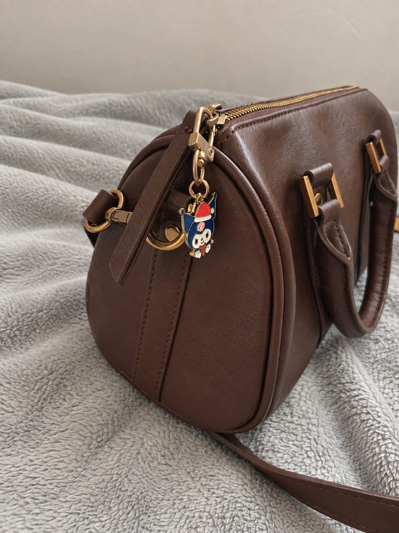 Brown Barrel Bag with Cute Charm included (Category: Purses & Pouches) located in La Trinidad. Submitted by honeysplushies2 (Listing ID 1463422850, Image 2). Description: like new condition very classy no flaws quality material .